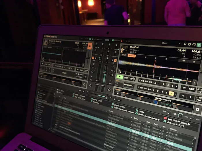 A laptop with a DJ software playing the song 'The End'